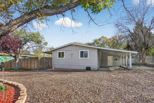 Φωτογραφία efficient home with outdoor features, property includes easycare landscape and p