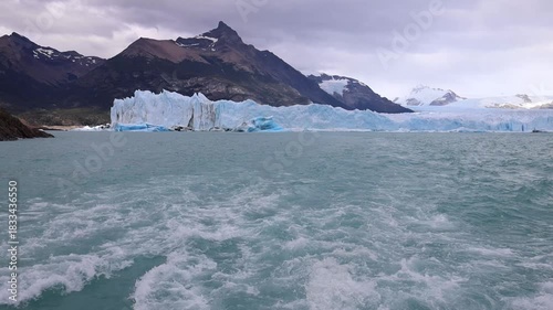 Perito Moreno Glacier in Patagonia showing massive ice wall, turquoise water, frozen textures, rugged wilderness, dramatic landscape, natural environment, climate scenery majestic travel area backdrop