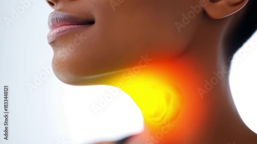 Woman’s Neck Showing Throat Pain Area Marked with Strong Orange Illumination