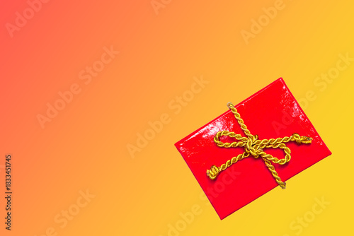 Christmas background - red gift box with golden cord