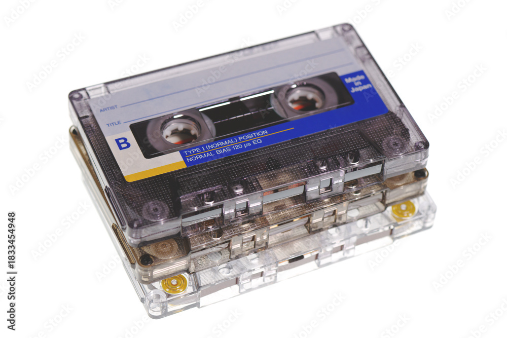 Obraz premium Stack of retro audio cassettes isolated on white background
