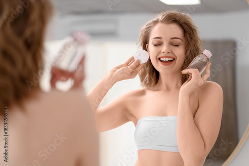 Beautiful woman with bottle...