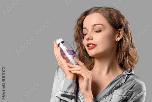 Young woman in pajamas with...