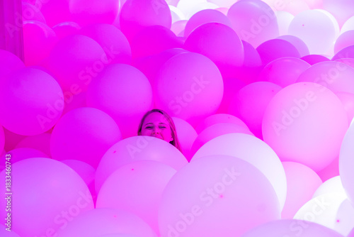 A Captivating Creative Photo Set Against a Beautiful Sea of Pink Balloons