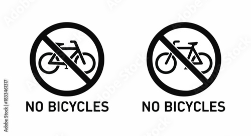 Two black and white circular 'No Bicycles' prohibition signs with a bicycle icon crossed out, indicating no cycling allowed in the depicted area.