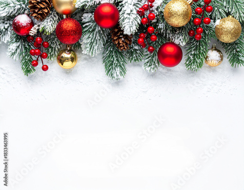 Elegant Snowy Christmas Fir Border with Red Berries, Golden Baubles, and Pinecones on White Background.