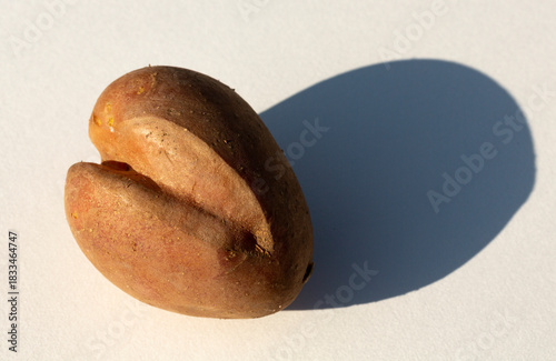 A strangely shaped potato on a white background.