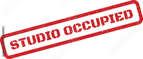 Official red rubber stamp with a vintage distressed texture displaying the words Studio Occupied to denote a creative space is unavailable for use