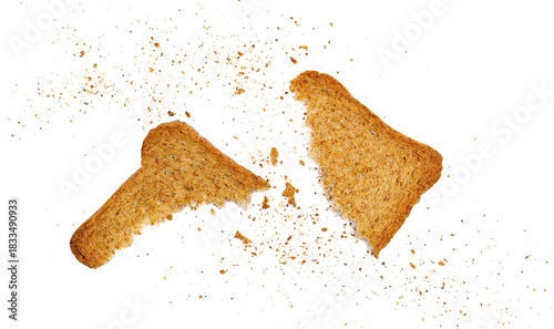 Broken rusks with wholewheat flour, pieces whole wheat dry bread with crumbs isolated on white background, top view