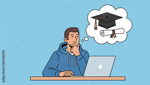 A young man is sitting at a desk, working on his laptop and dreaming about graduating and receiving his diploma and cap