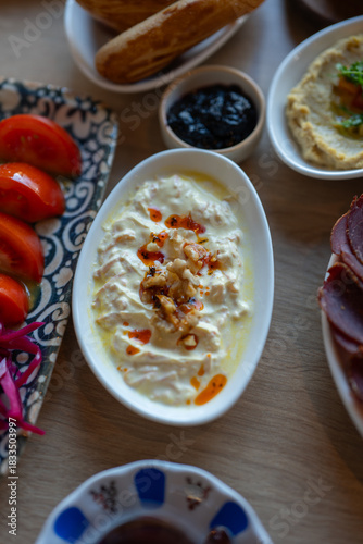 Wallpaper Mural Delicious Turkish Meze Platter With Haydari Yogurt Dip Tomatoes Pastrami Hummus and Bread on a Wooden Table for Restaurant Menus Torontodigital.ca