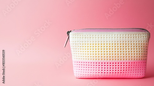 bronzer. Cosmetic bag closeup against soft pink backdrop with even illumination, lifestyle magazines, social media lookbooks, designed for influencer and brand collaborations.
