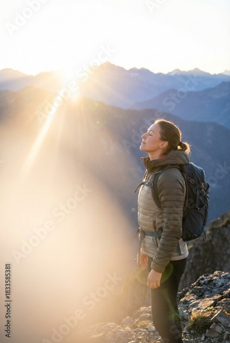 Serene Female Hiker Breathing Fresh Air at Mountain Summit Sunrise