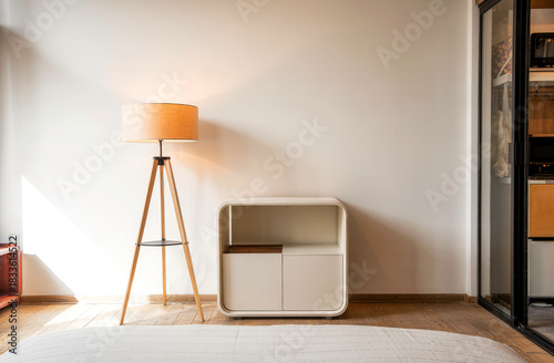 Minimal Interior With Floor Lamp And Cabinet bathed in Warm Sunlight in Modern Living Space