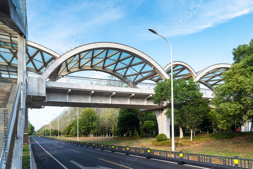 Pedestrian bridge against blue sky