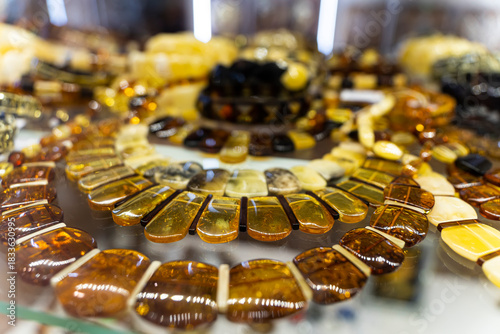 Jewelry made of amber. Natural amber on the table.