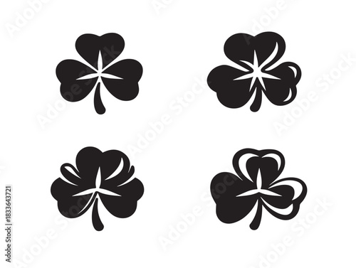 A nice set of four shamrock silhouette icons in minimalist black
