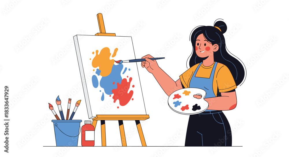 Fototapeta premium Talented female artist in an apron painting a colorful abstract picture on a canvas with a brush and a palette in her hands.