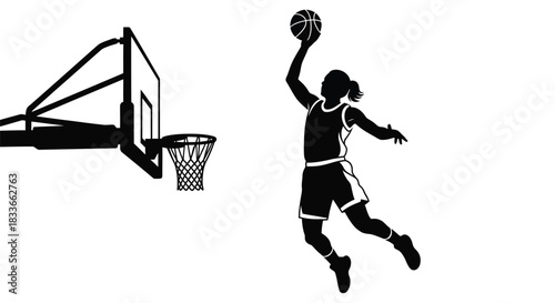 Silhouette of a female basketball player leaping to score a basket during a game.