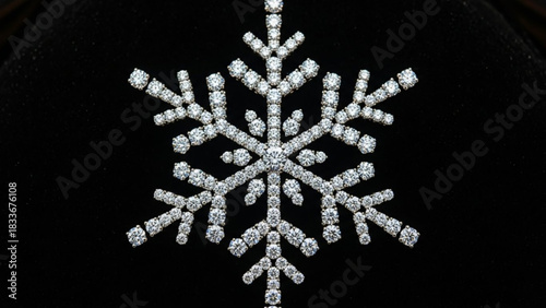 A stunning snowflake pendant crafted from sparkling diamonds intricately arranged to capture the beauty of winter s delicate ice crystals against a dark background