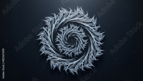 Intricate frost pattern forming a delicate spiral on a dark background with subtle light effects and floating ice crystals
