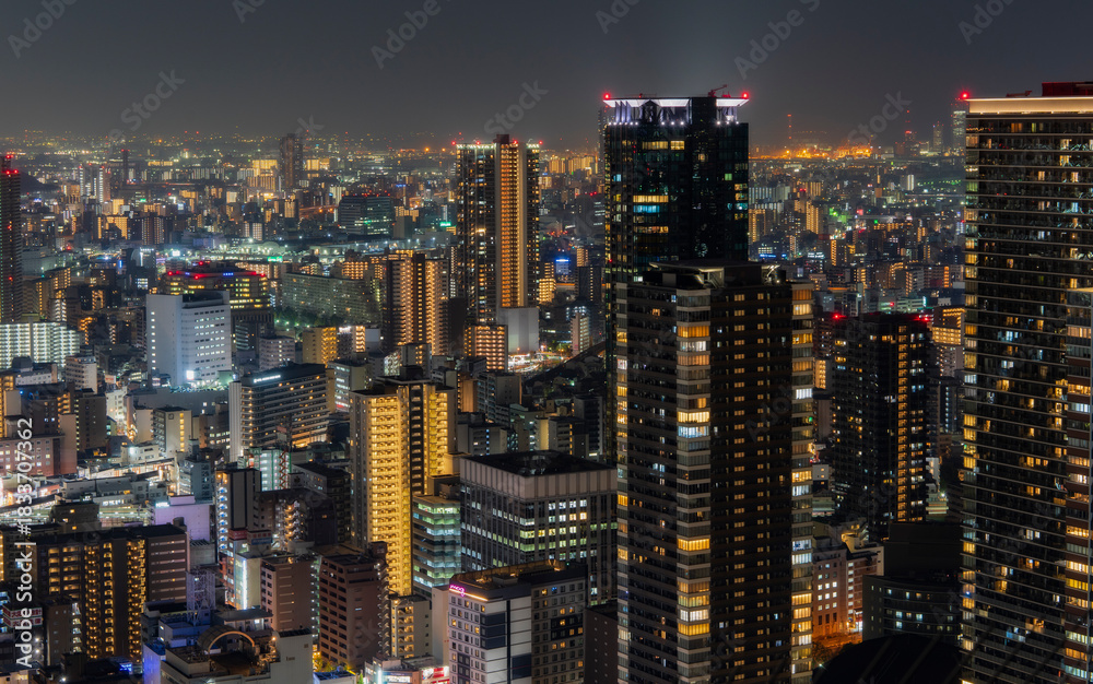 Fototapeta premium High angle view of illuminated buildings in Osaka city at night