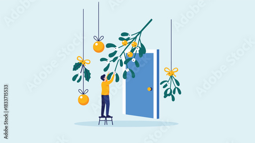 Christmas holiday preparation concept, showing a person on a stool hanging mistletoe and ornaments above a doorway for decoration.
