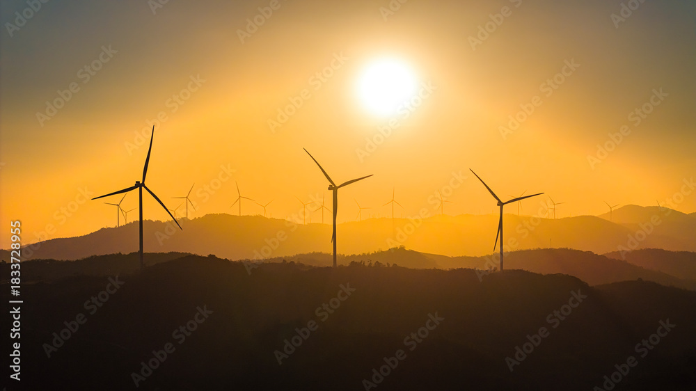 Obraz premium Panoramic view of wind farm or wind park, with high wind turbines for generation electricity with copy space. Green energy concept, Quang Tri, Vietnam
