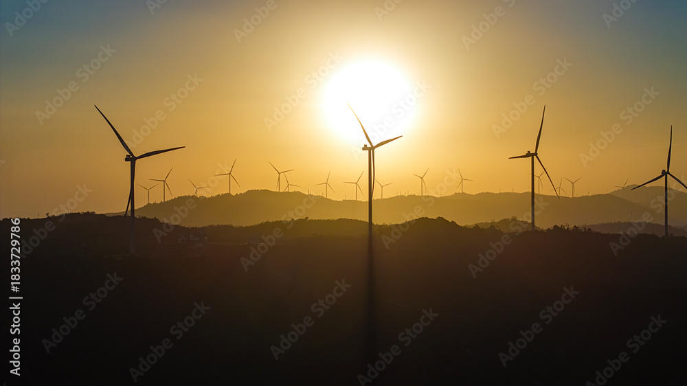 Fototapeta premium Panoramic view of wind farm or wind park, with high wind turbines for generation electricity with copy space. Green energy concept, Quang Tri, Vietnam