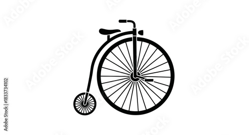 Silhouette of a Classic Penny-Farthing Bicycle with Large Front Wheel.