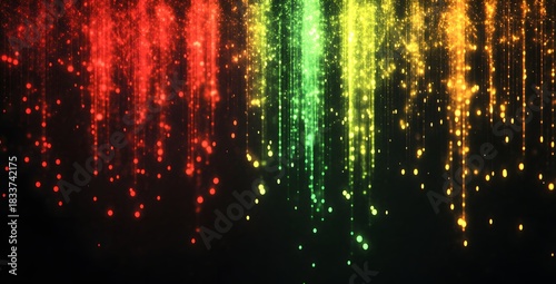 Abstract vibrant rainbow colored streaks of light particles falling downwards in a dark background creating a festive and energetic visual effect