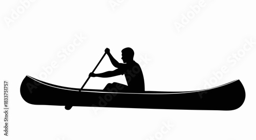 Silhouette of a Person Canoeing.