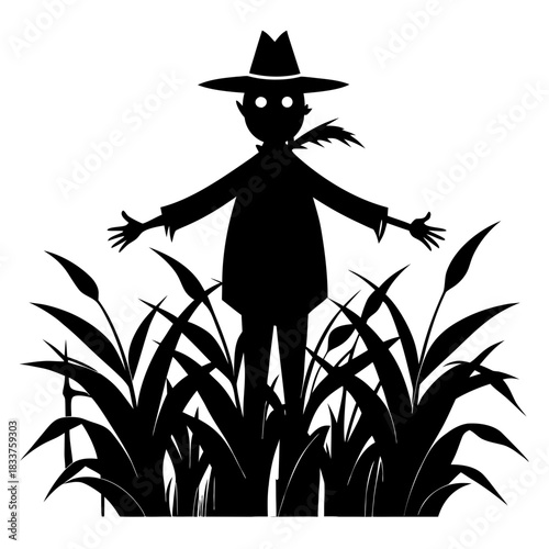 Silhouette of a scarecrow standing in tall grass at night