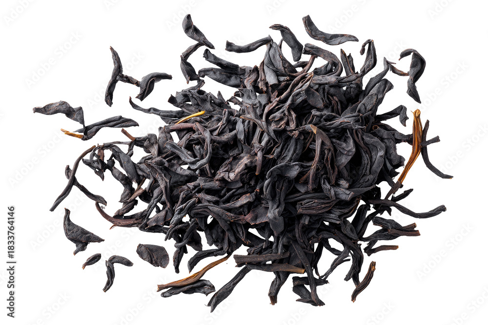 Obraz premium Dark, dried tea leaves in a pile, overhead shot on a black background