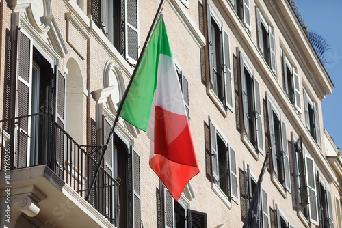 Fototapeta Naklejka Na Ścianę i Meble -  Italian flag on the streets of Rome, Italy.
