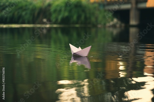 Paper boat floats on the water