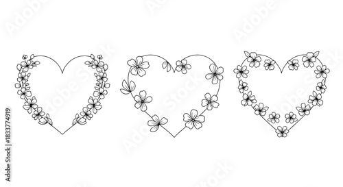 Set of three delicate heart-shaped frames decorated with hand-drawn cherry blossom flowers for romantic card designs.