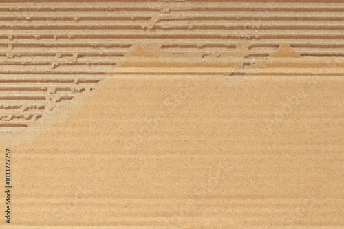 Brown cardboard sheet abstract background, texture of recycle paper box in old vintage pattern with ripped edges.