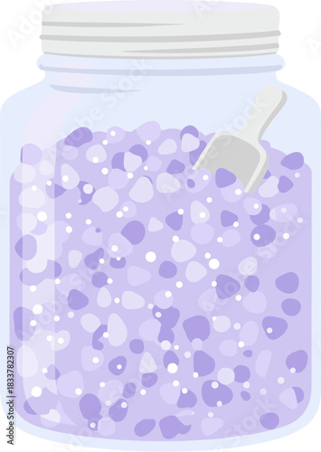 Glass jar filled with purple lavender bath salts and a scoop.