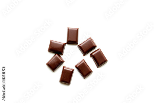 Pieces of tasty chocolate isolated on white
