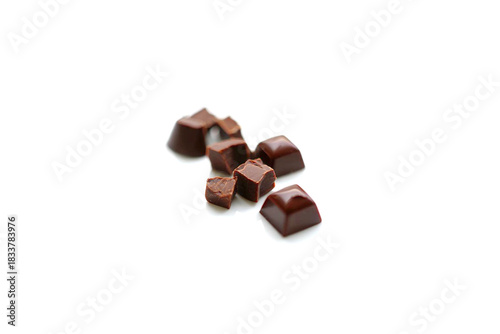 Pieces of tasty chocolate isolated on white
