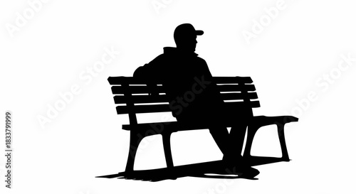 Silhouette of a person sitting on a park bench enjoying the outdoors.