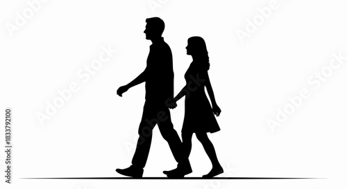 Silhouette of a couple walking together holding hands.
