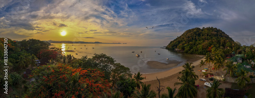 Tableau sur toile Panoramic sunrise aerial of Sakatia Island, Nosy Be, Madagascar – golden light over the ocean, tropical coastline, and peaceful island landscape