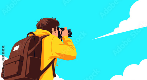 A young male tourist with a backpack and bright yellow hoodie captures the scenic view through his camera lens against a vibrant blue sky.