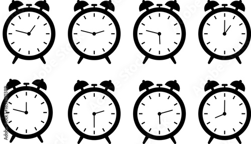 Collection of vintage alarm clocks displaying different times