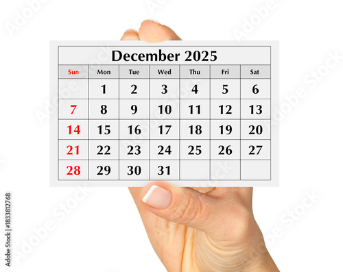 Page of the annual monthly calendar december 2025 in hand. Isolated on transparent png