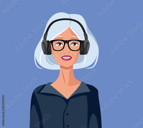 Happy Elderly Woman Wearing Headphones Listening to a Podcast. Senior lady enjoying an audio podcast or audio book
