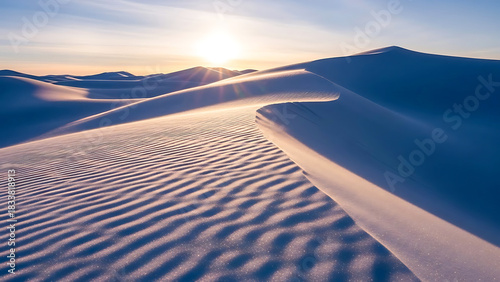 Sand dunes landscape with wave pattern desert horizon and sun shining bright