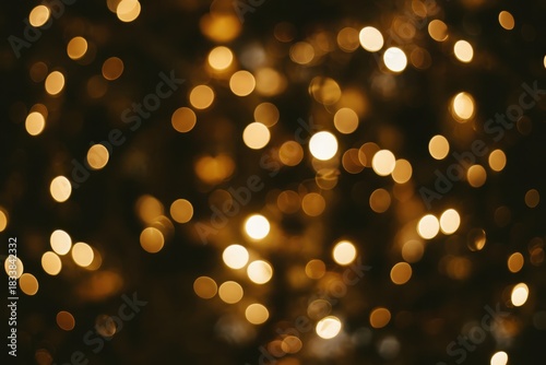 Golden bokeh on the black background. Bokeh texture.
